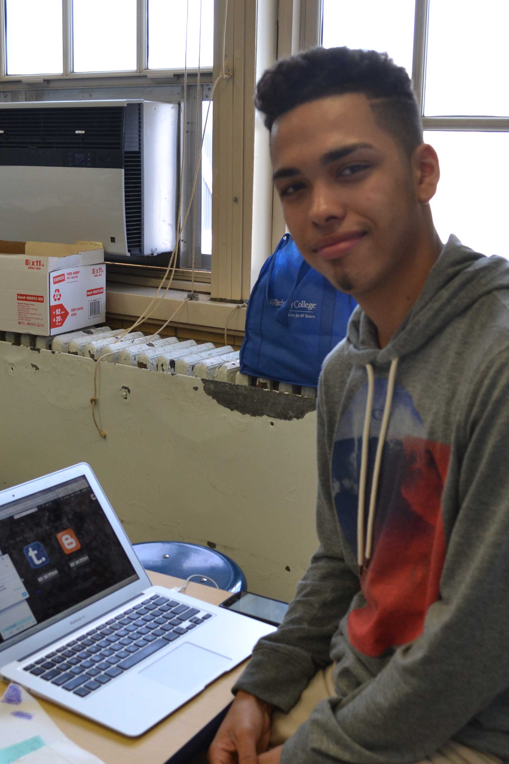 Freshman Ruben Germosen works on Dreamyard MOUSE Squad social media.