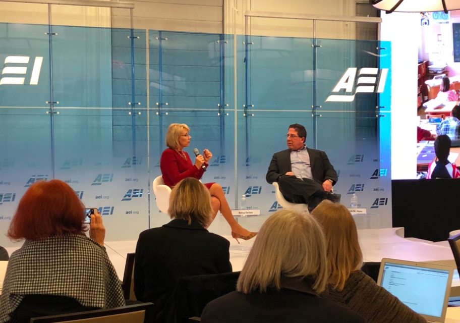 Betsy DeVos sitting with Rick Hess