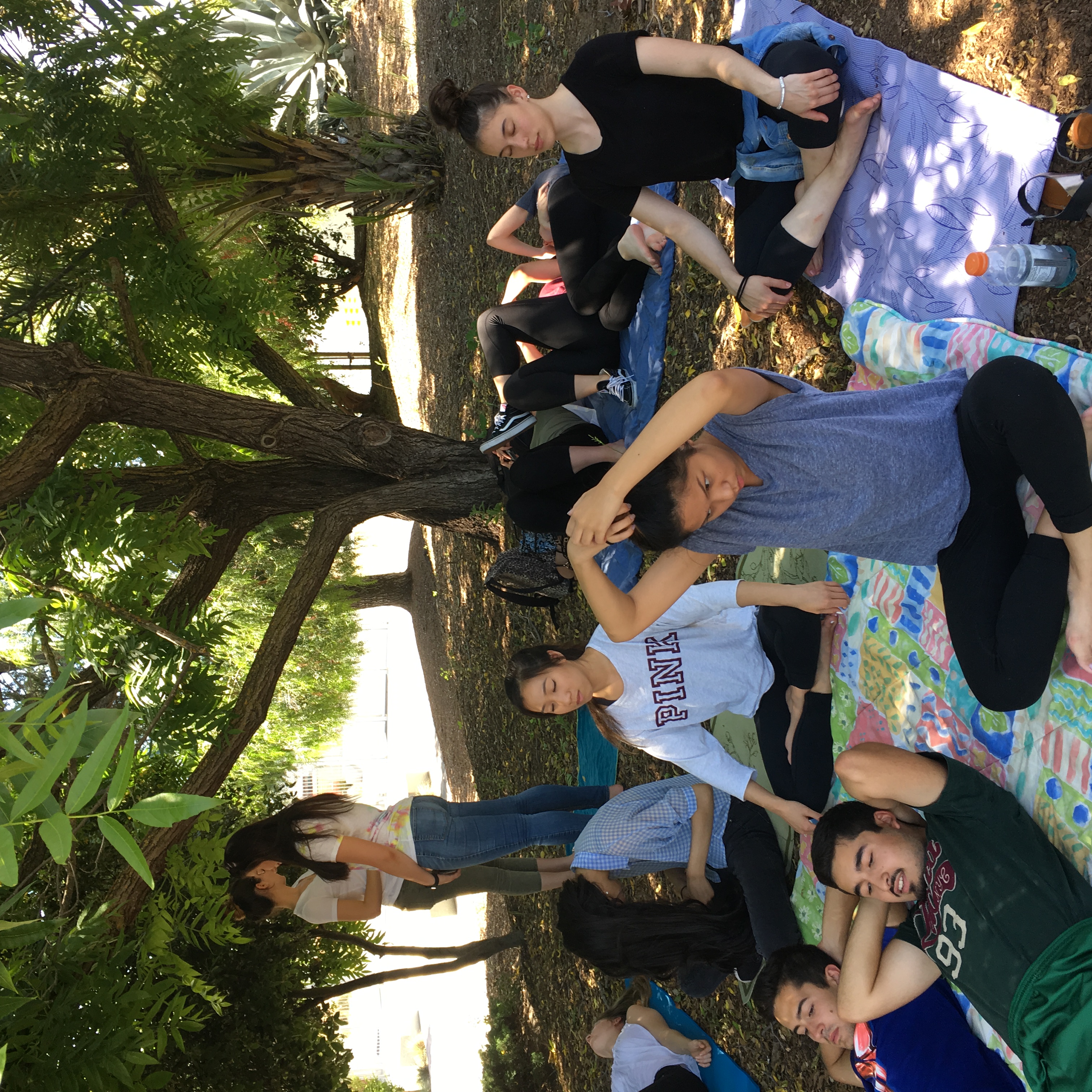 Students doing yoga in the garden. Photo Credit: Serena Maniscalco