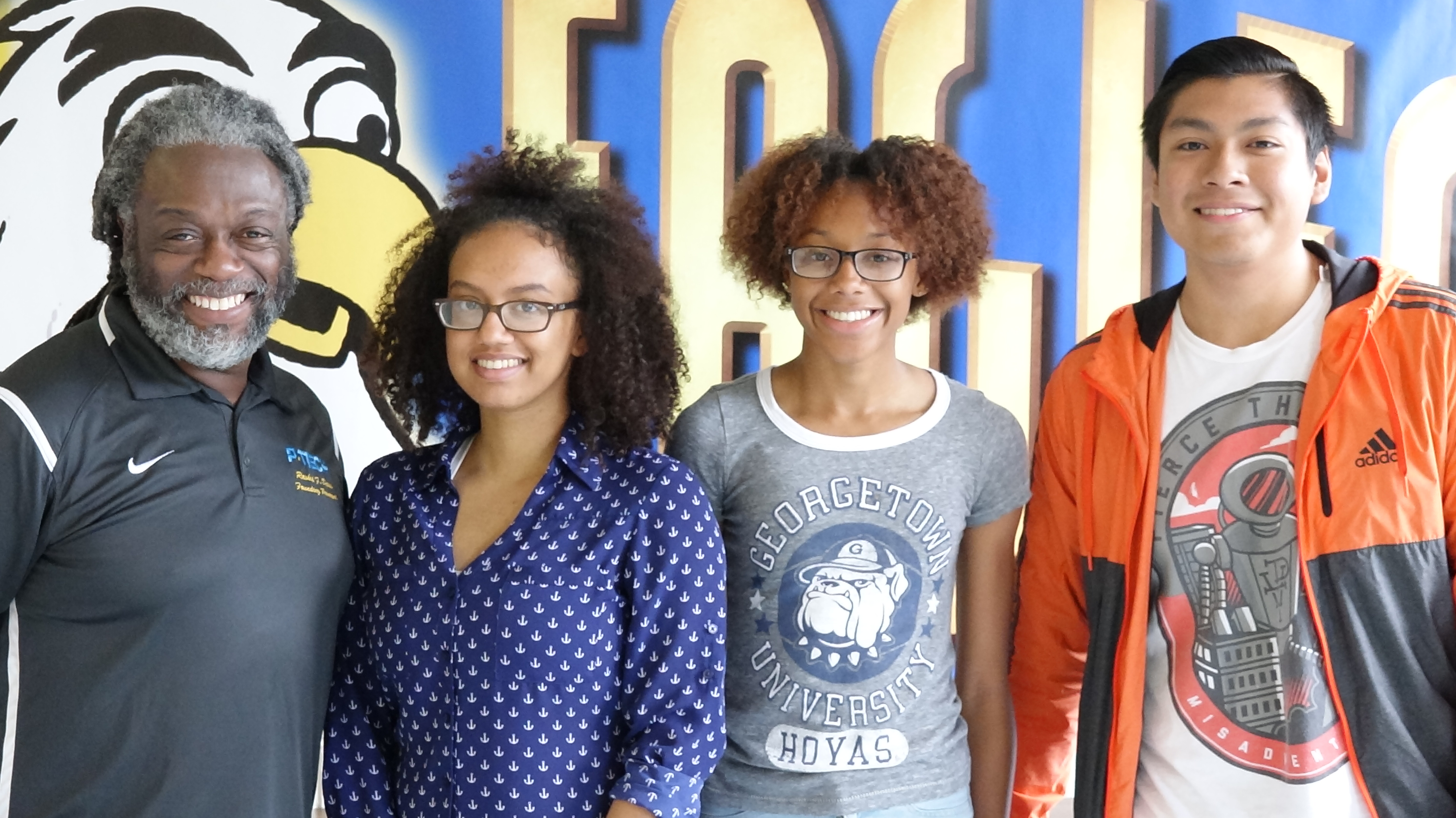From left to right: Principal Rashid Davis, and graduating seniors Penelope Garcia, BryAnn Sandy and Oscar Tendilla