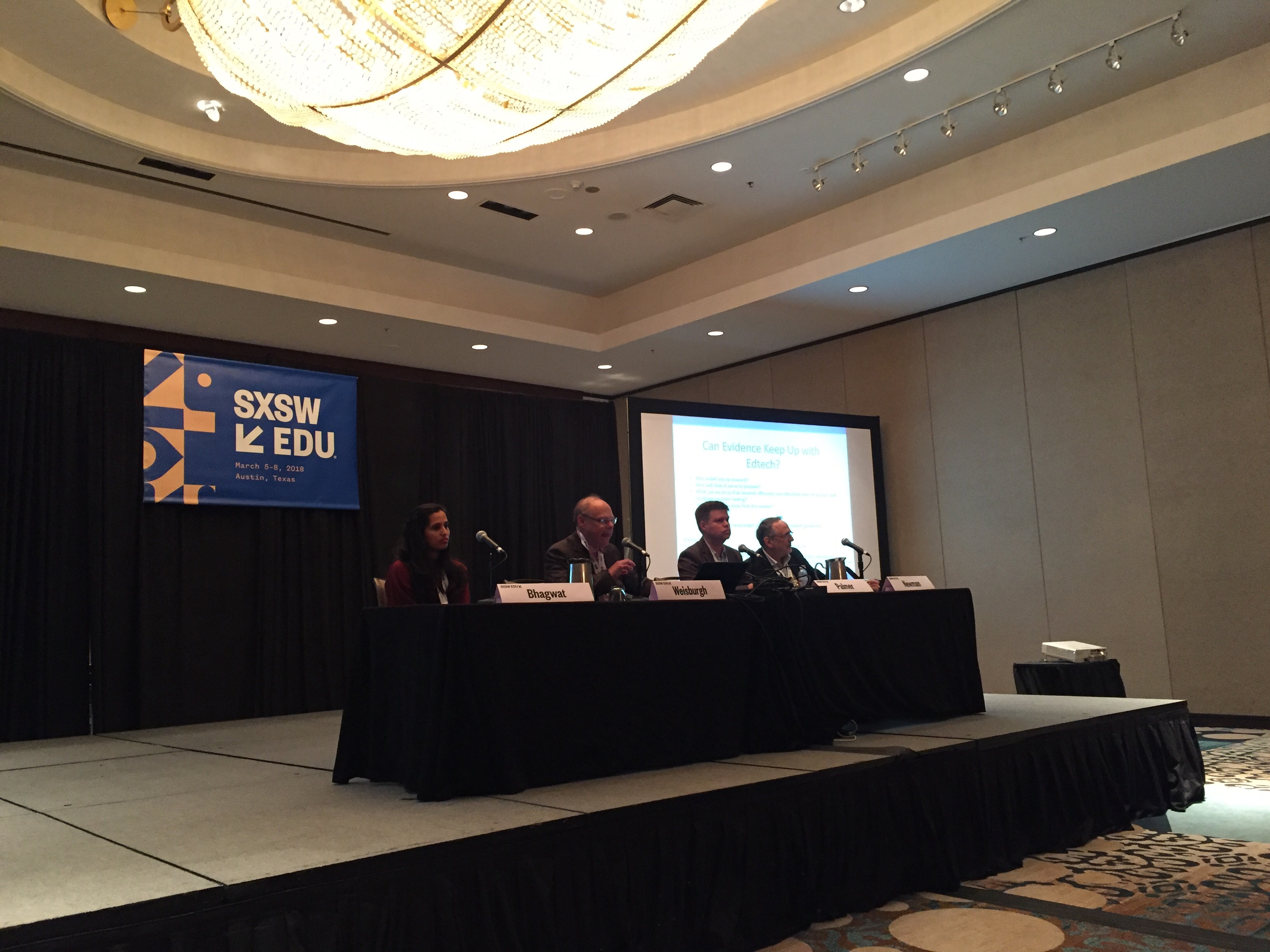 Panelists Malvika Bhagwat, Mitchell Weisburgh, Jason Palmer and Denis Newman.