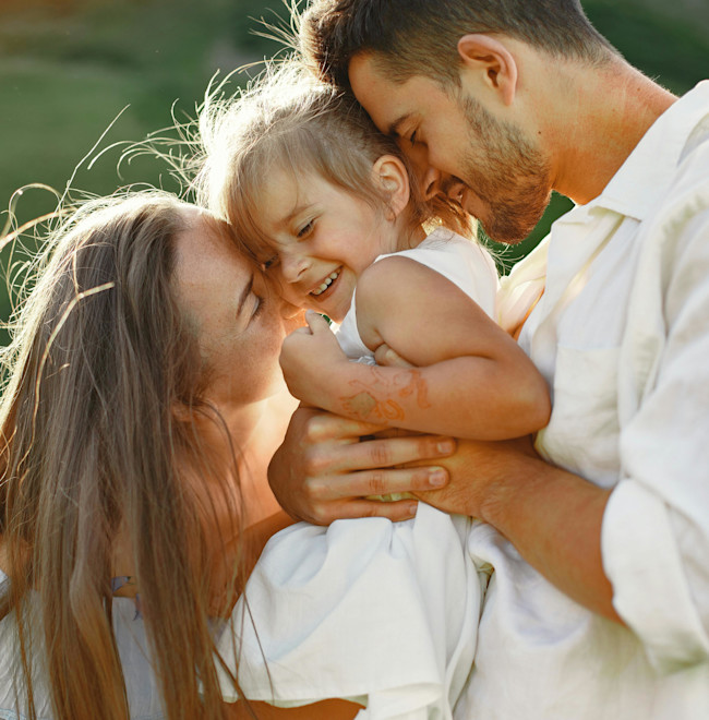Two parents with their child.