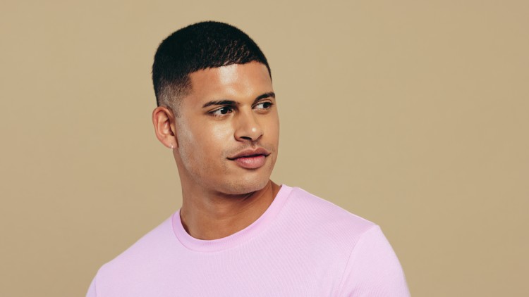 man with pink shirt, glowing clear skin