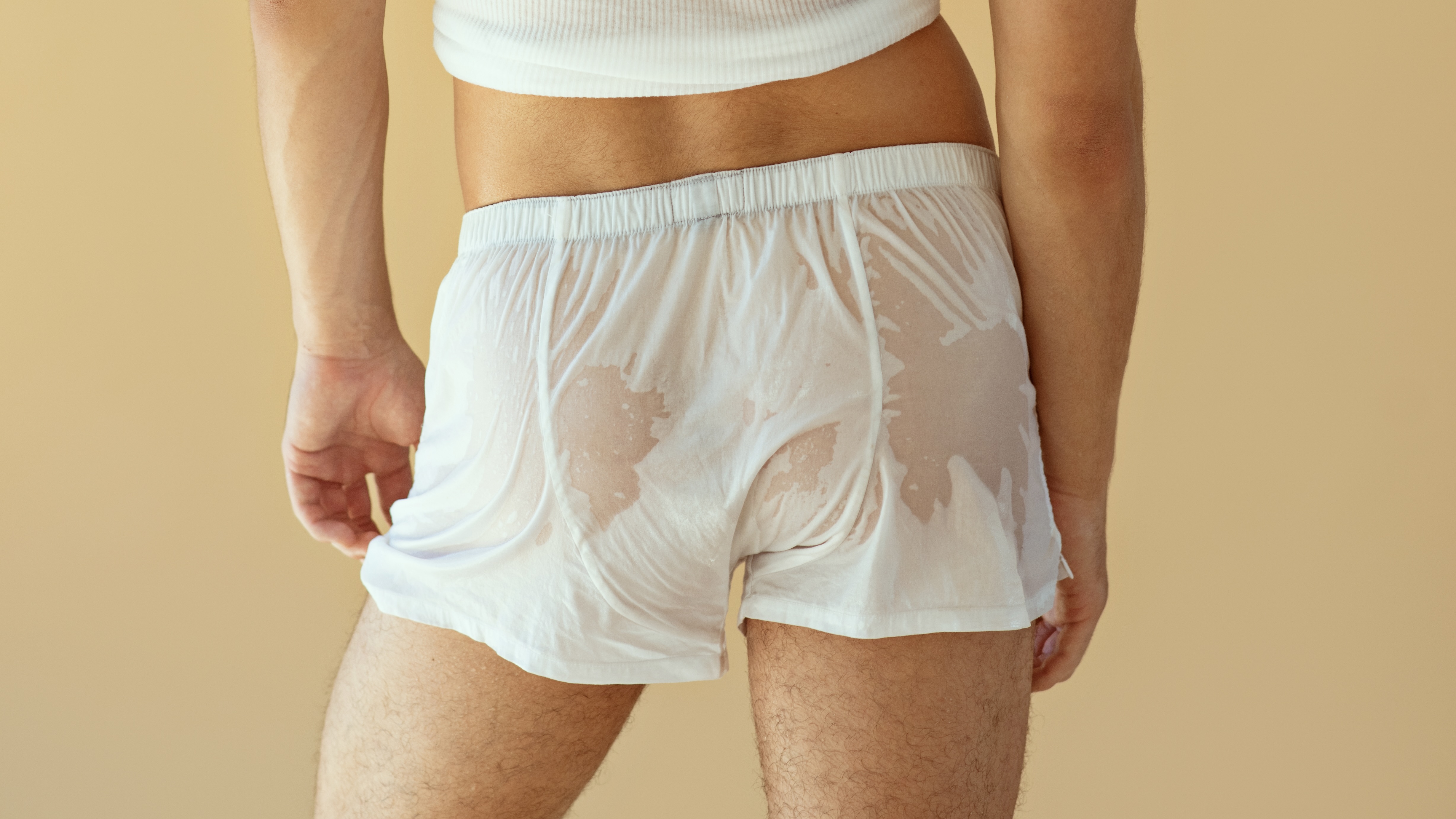 hero image of male in wet swimwear