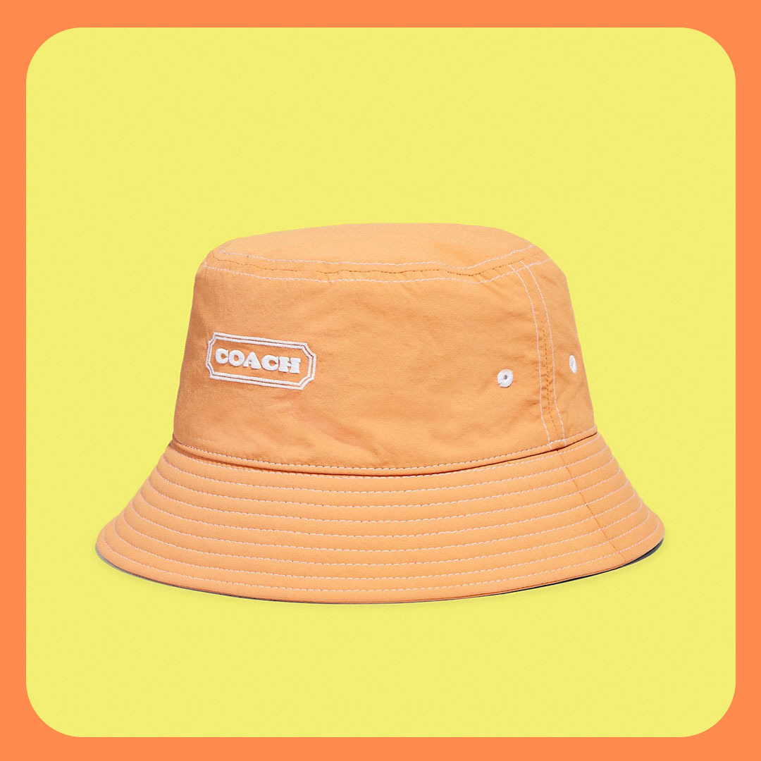 Orange bucket hat with Coach