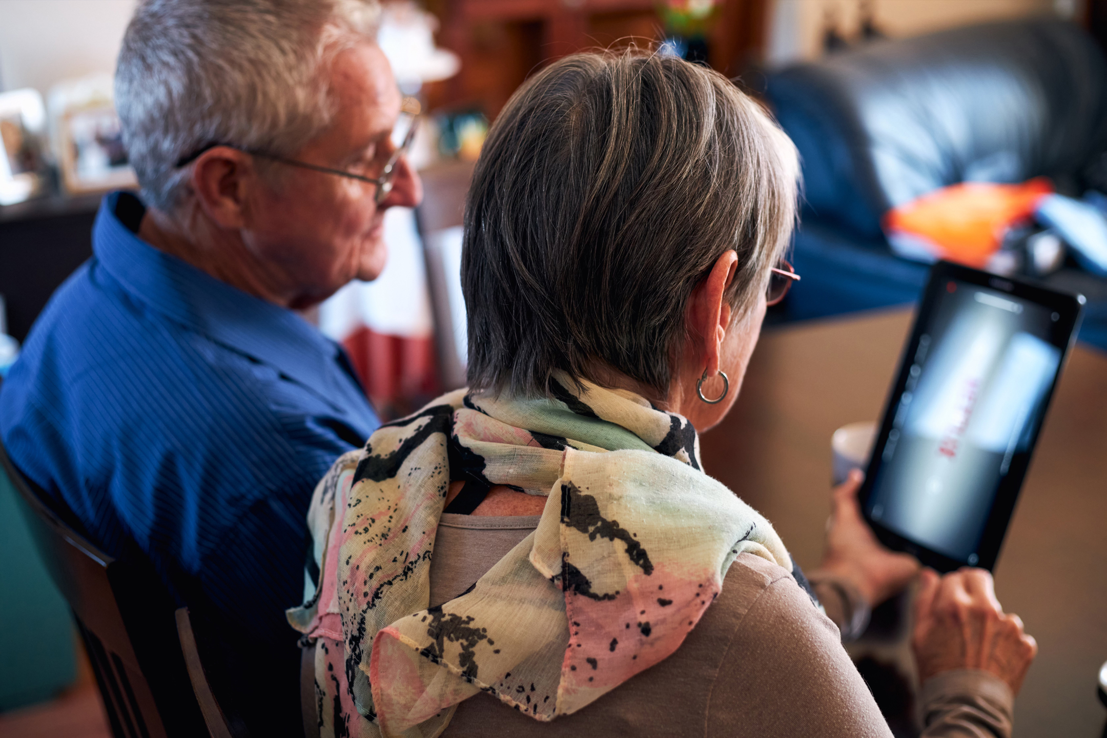 Two people using a tablet