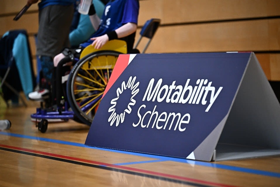 A Motability Scheme Sign at a sporting event