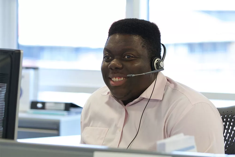 Call centre adviser with headset