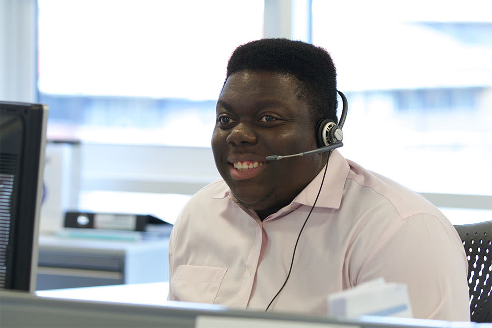 Call centre adviser with headset