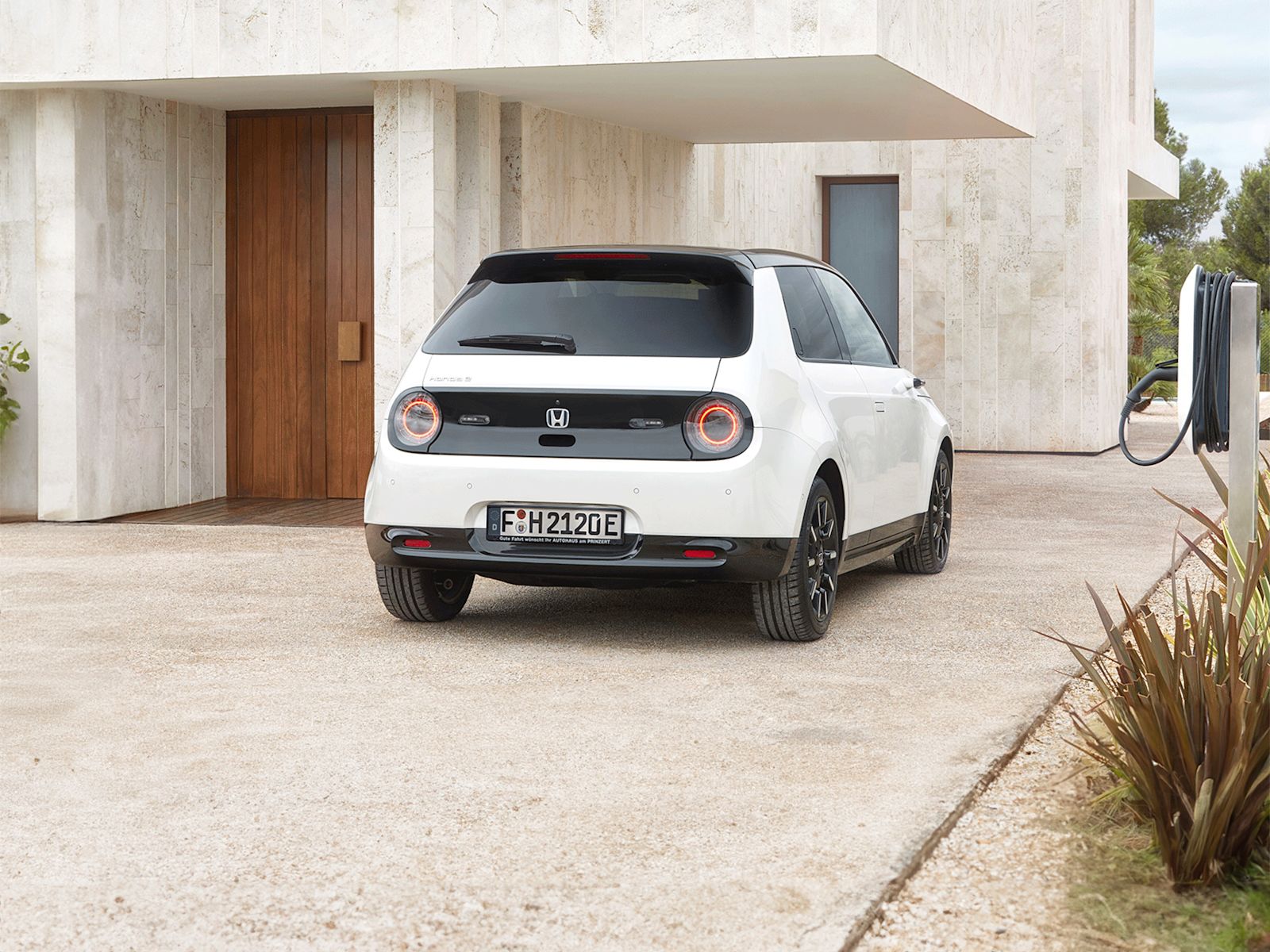 Honda E in white rear facing