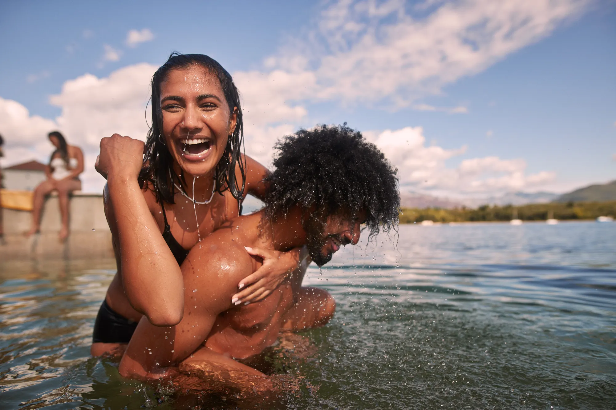 Couple in the sea laughing 