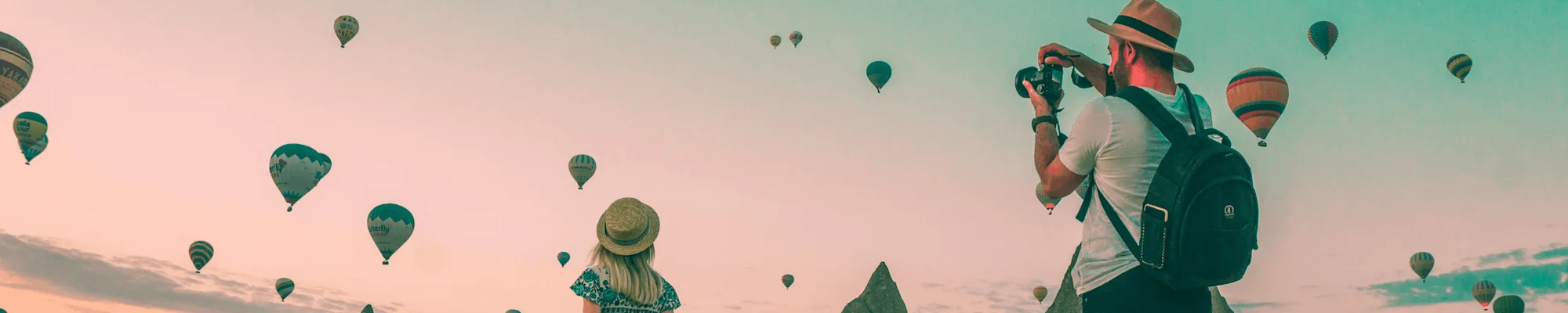 Two People Watching Hot Air Balloons