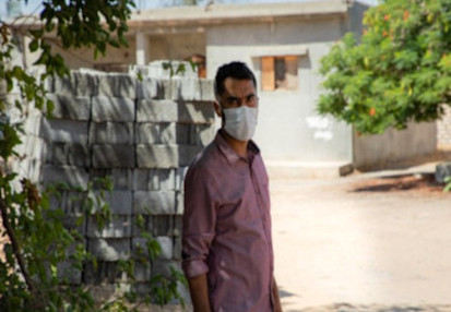 Riad at a reconstruction project for a displaced family in Tripoli (IOM/Moayad Zaghdani)