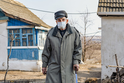 Mykola is standing in his yard in village at the "contact line"