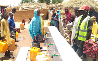 Halima at water collection point – Shuwari-6, el-Miskin Transit Camp Maiduguri, Borno