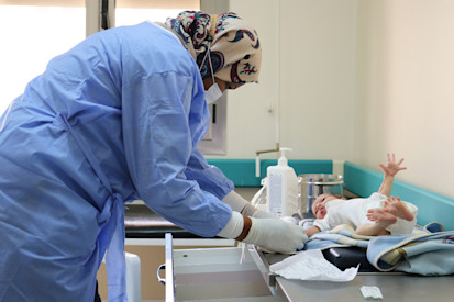 Eight-month-old Ahmed is vaccinated at a WHO-supported primary health care centre in Sabha. (WHO)