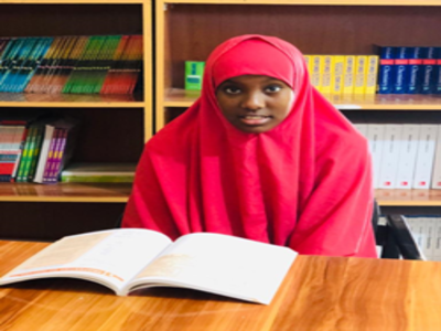 Shukri in the Library reading books-