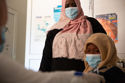 Fatima at a primary health care centre in Gergaresh, Tripoli (UNHCR/Mohamed Alalem)