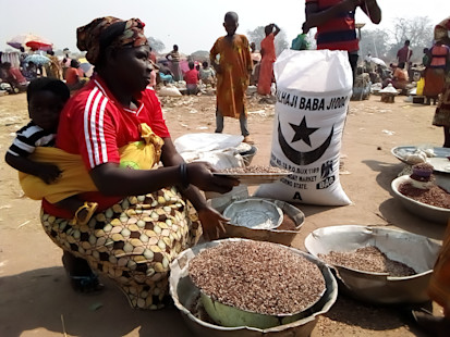 Brigitte Gbenou selling millet at the Lazaré IDP site market. ©OCHA/Prisque Bongole, Kaga-Bandoro, Nana-Gribizi Prefecture, CAR.