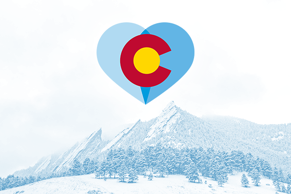 Colorado symbol in a heart over mountains