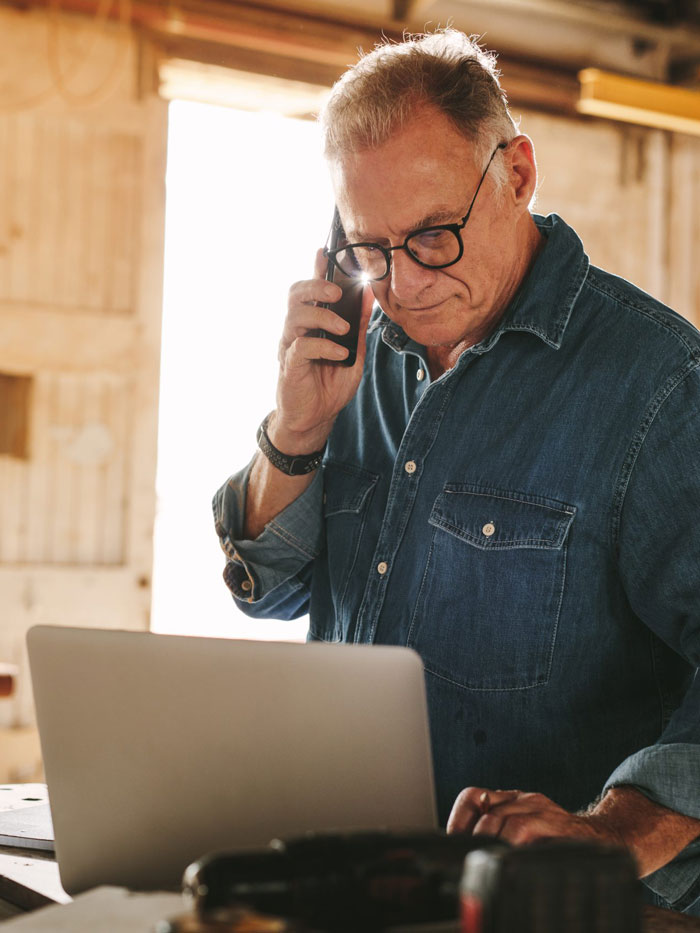 Man on phone in a small business