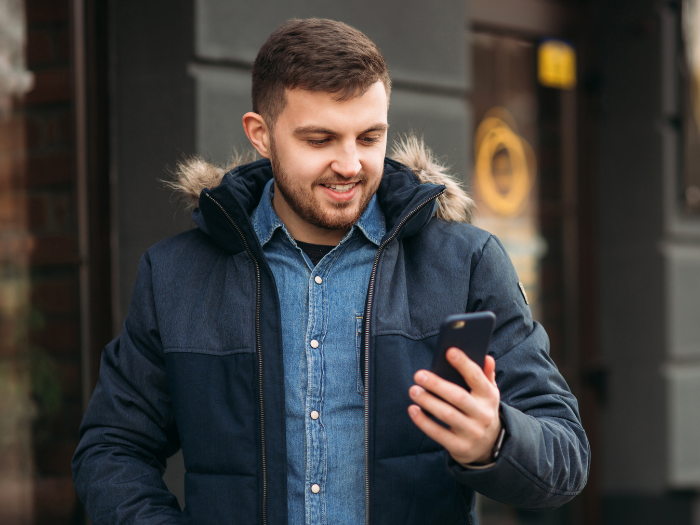 Man looking down a his phone