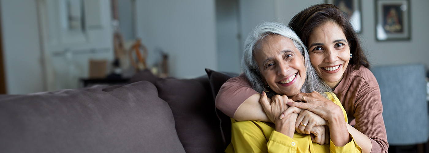 Daughter and elderly mom in an embrace