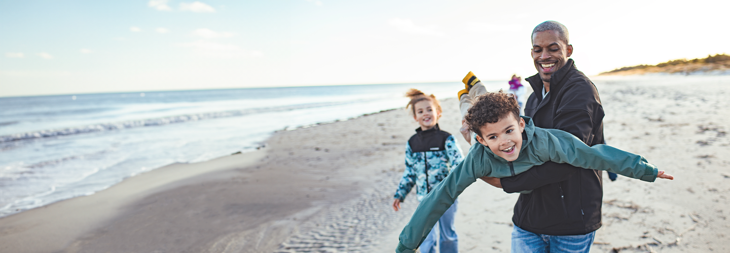 Family of 3 at the beach