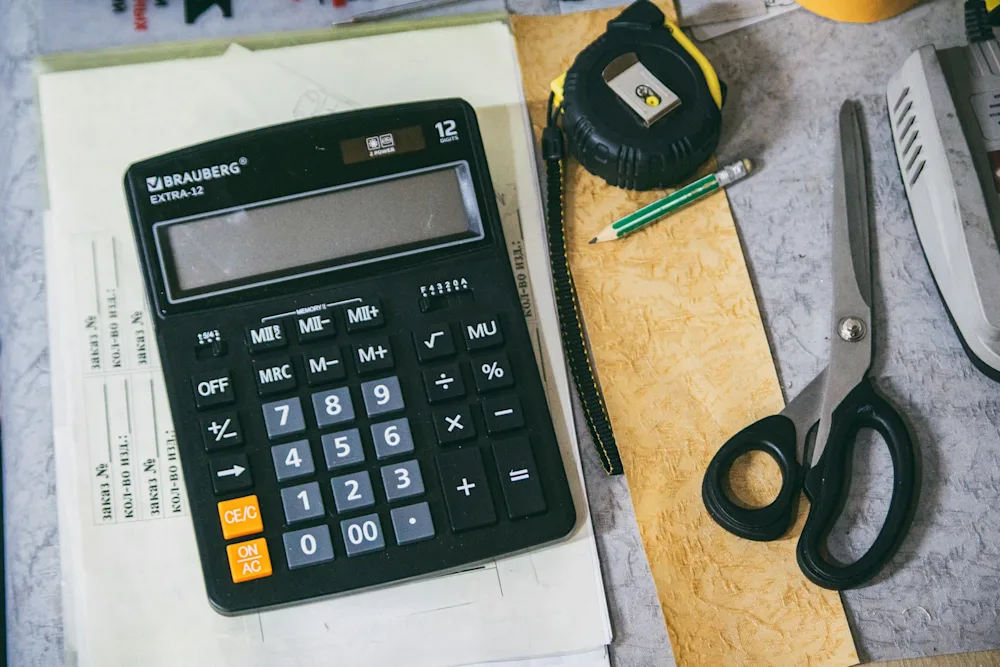 Calculator and office supplies for cost planning