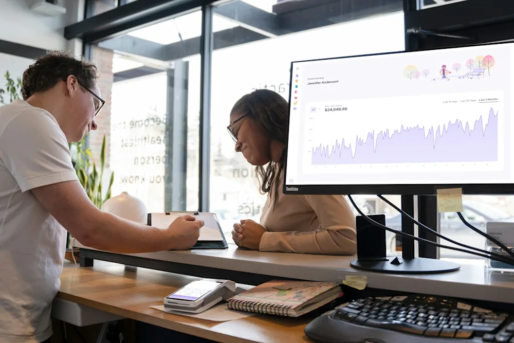 A team discussing business analytics and automation costs