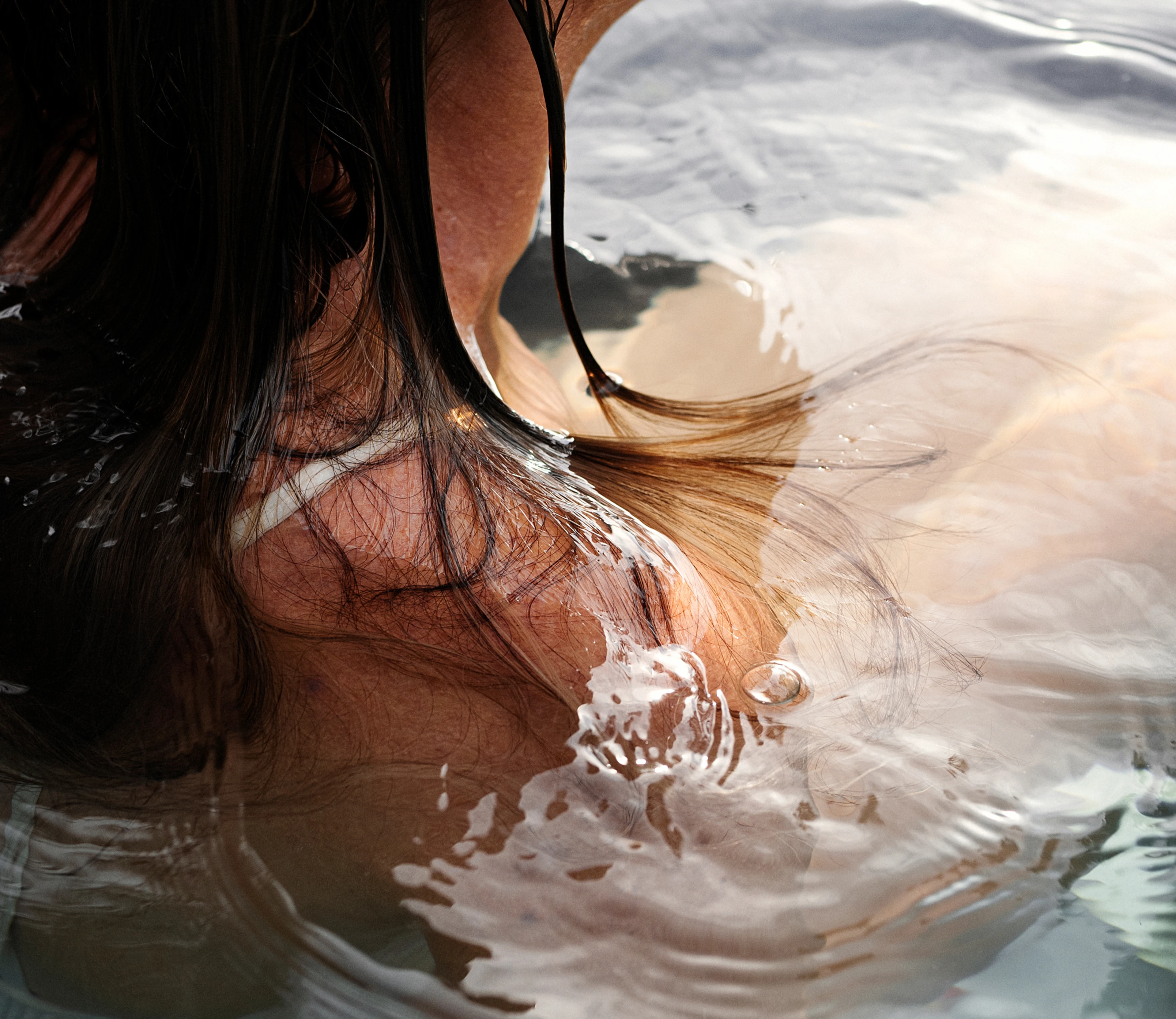 Detail of woman in a hot tub