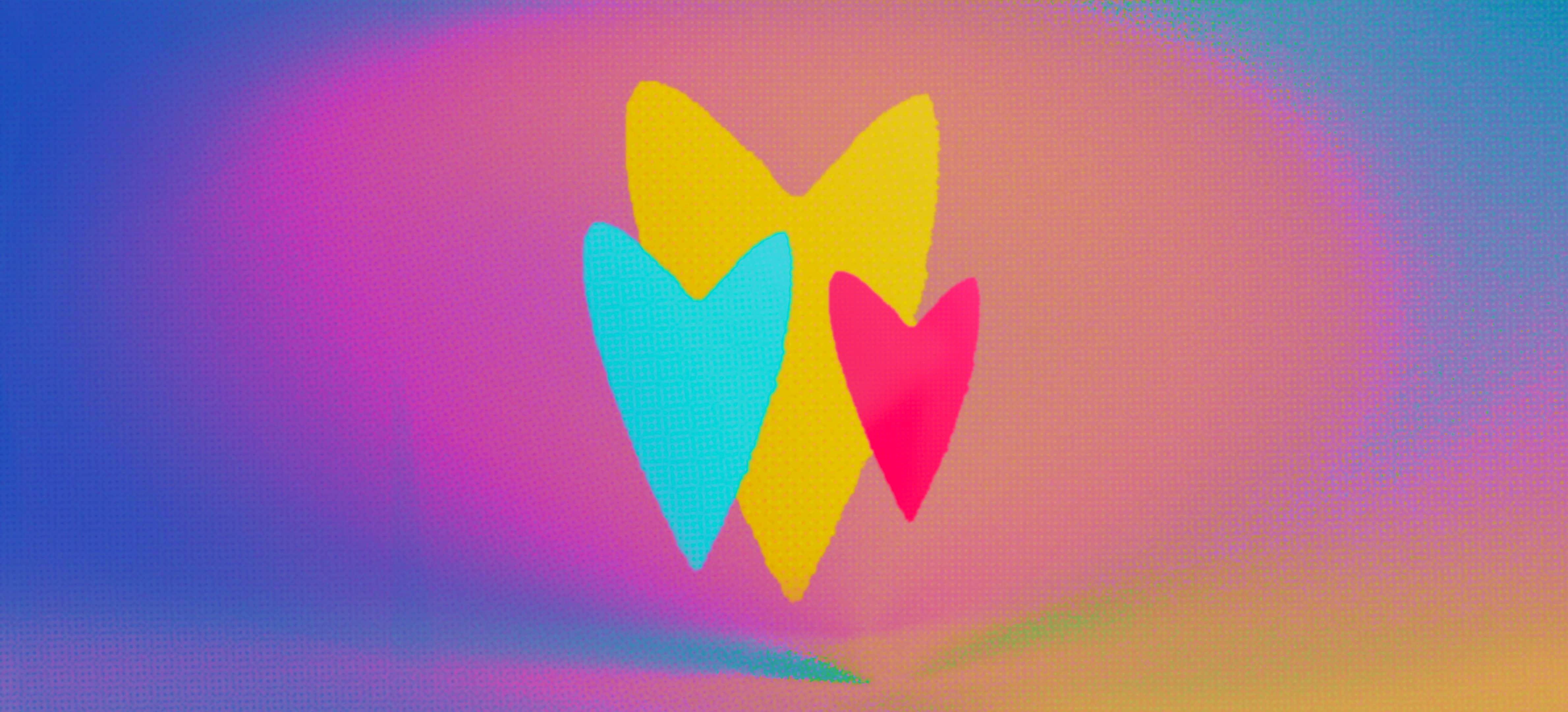 Three colorful hearts on a warm gradient background