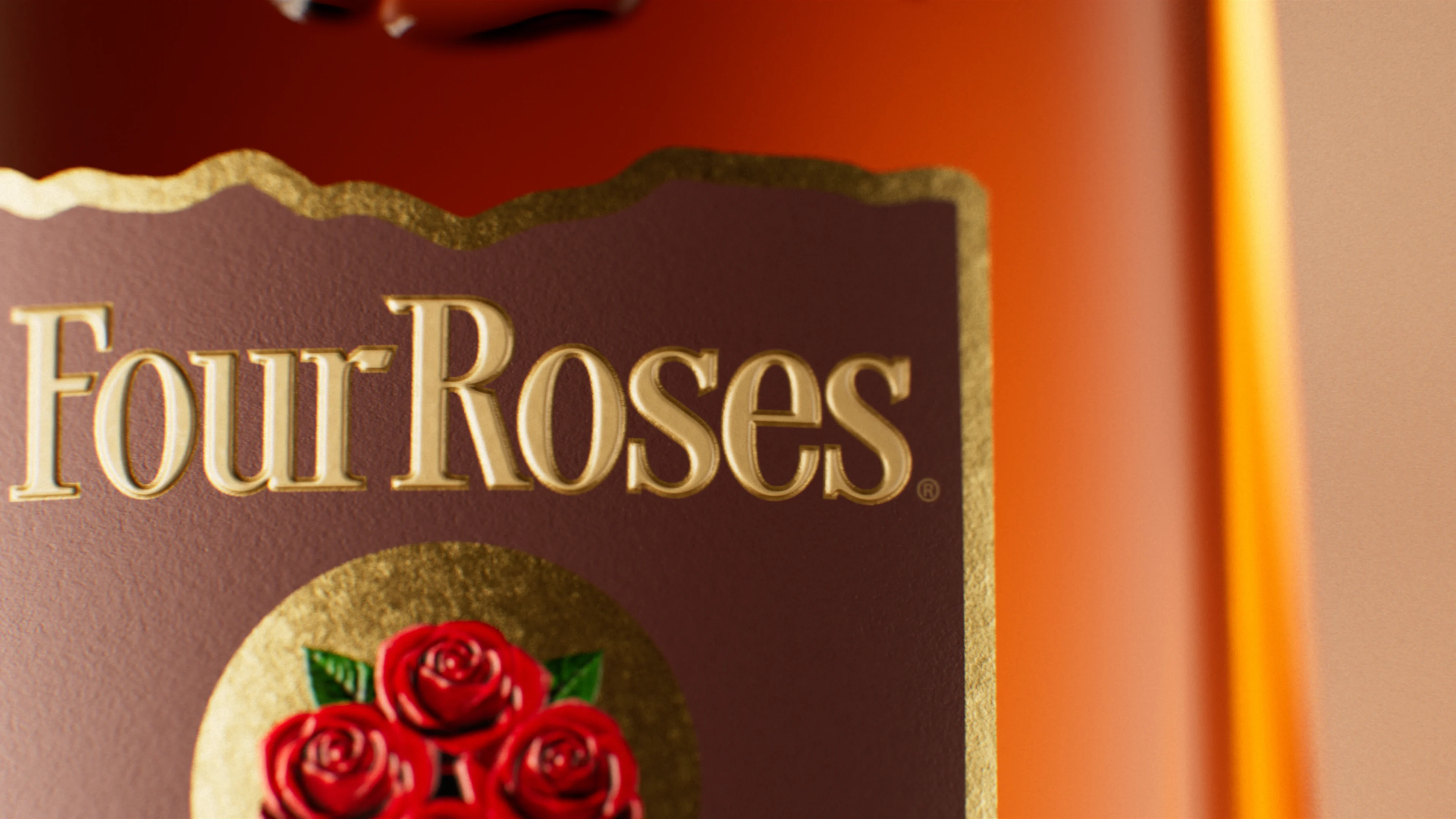 Close-up of Four Roses gold embossed logotype on a bottle