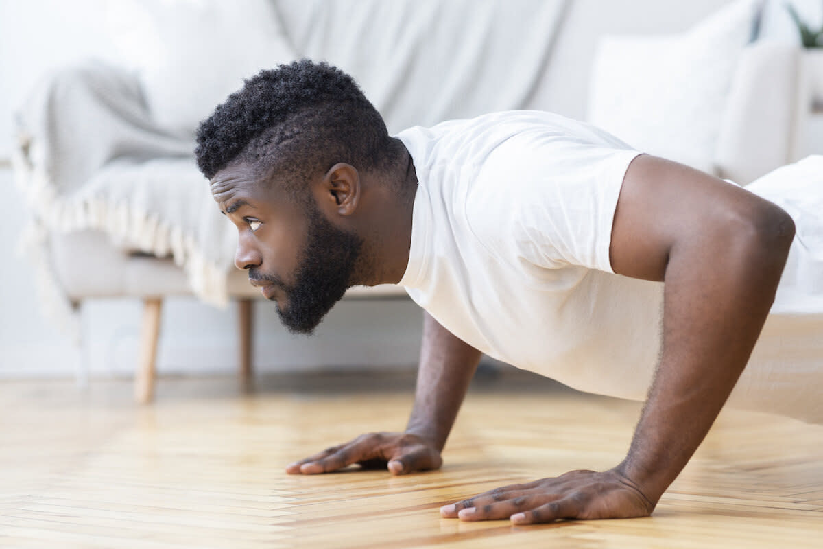 Benefits of personal training: man doing push-ups at home