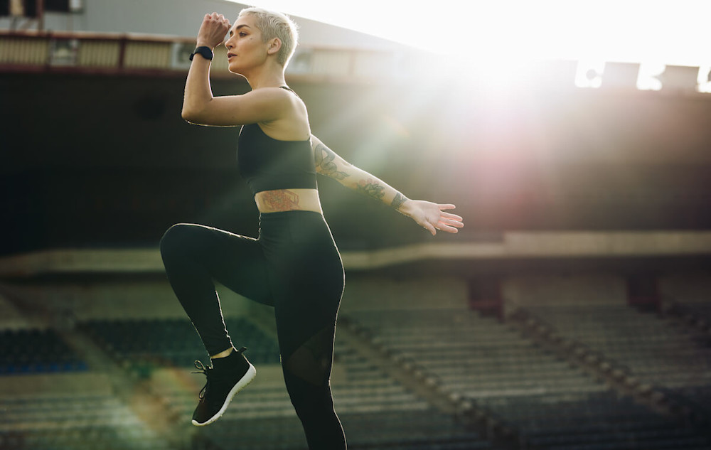 Woman doing some standing mountain climbers