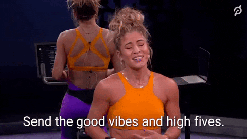 Woman using a stationary bike GIF