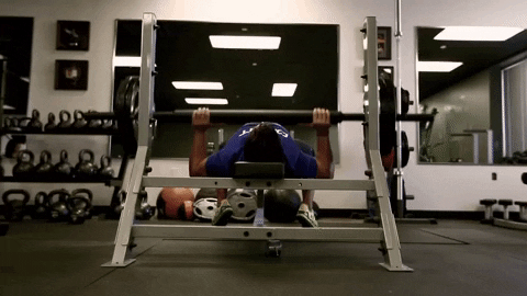 5x5 workout: man doing a barbell bench press GIF
