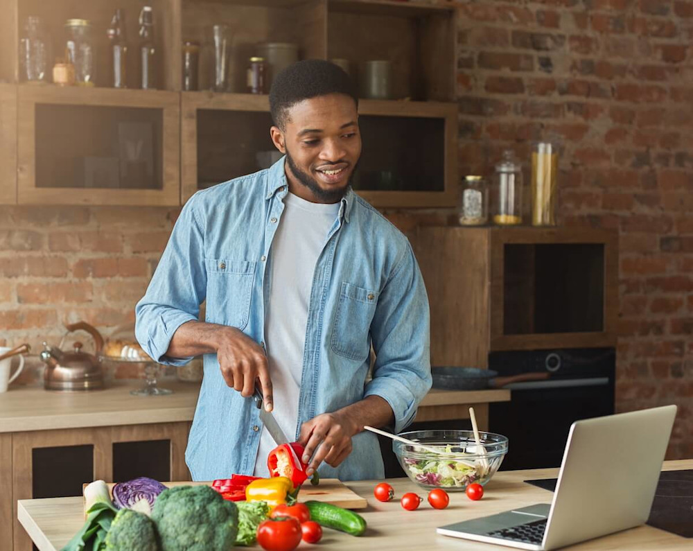 Man slicing some vegetables