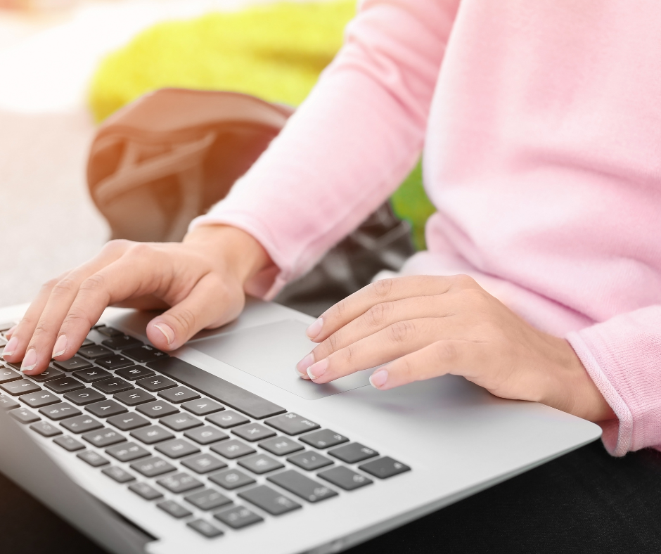 hands of the girl on laptop