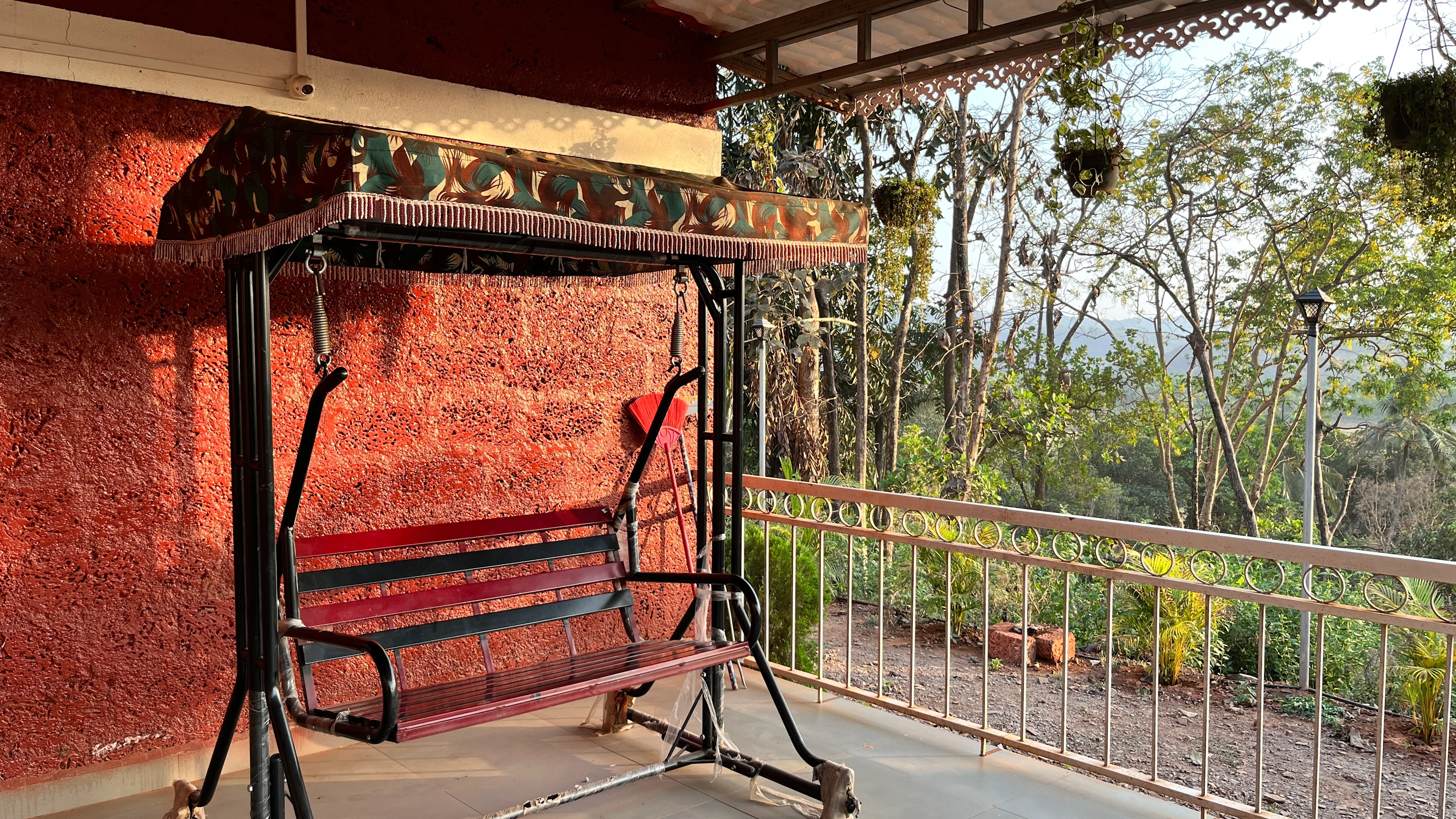 Veranda and relaxation area at Blossom Retreat — private patio overlooking the Konkan landscape