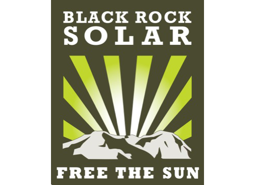 Black Rock Solar sticker. "Free the Sun." Green sunburst over mountain silhouette. Burning Man nonprofit, 2009.