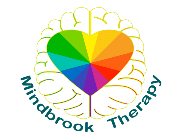 A vibrant rainbow heart is centered within a bold white brain outline, with dark teal “Mindbrook Therapy” text curved beneath