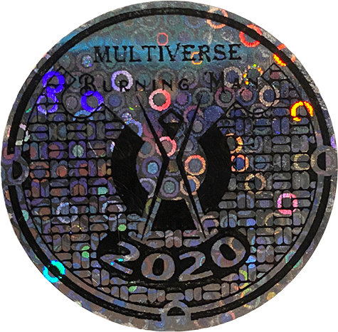 Circular Burning Man sticker labeled “Multiverse 2020,” featuring the Man symbol over a dark geometric pattern with multicolored reflective accents.