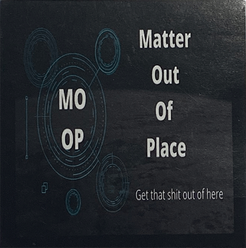 Square sticker with sci-fi circular graphics and the text “MOOP – Matter Out Of Place” and “Get that shit out of here” on a dark textured background.