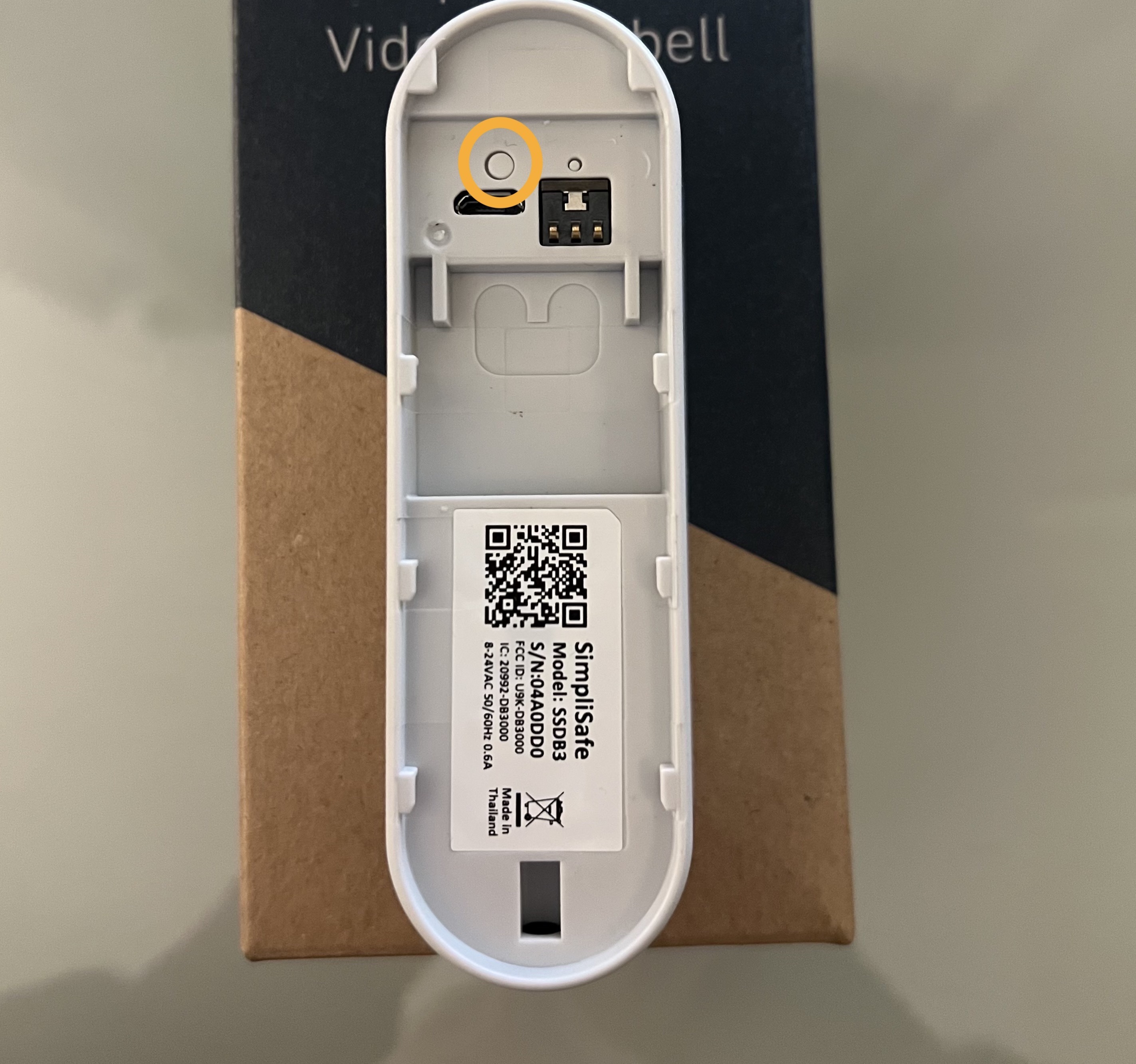 The back of the Video Doorbell Pro, with a circle around its larger, soft reset button.