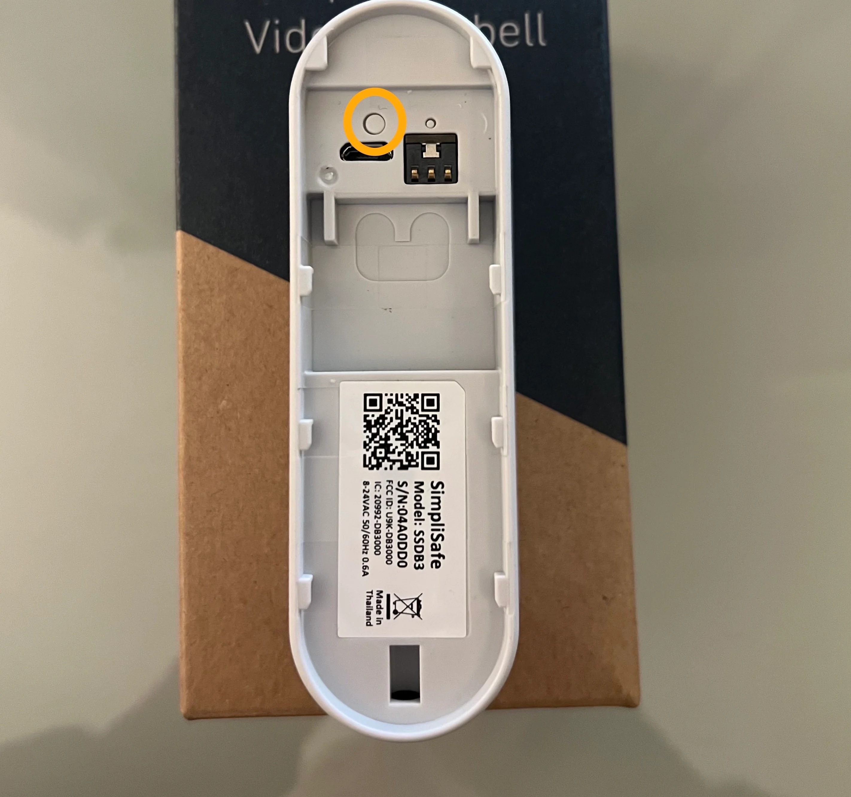 The back of the Video Doorbell Pro, with a circle around its larger, soft reset button.