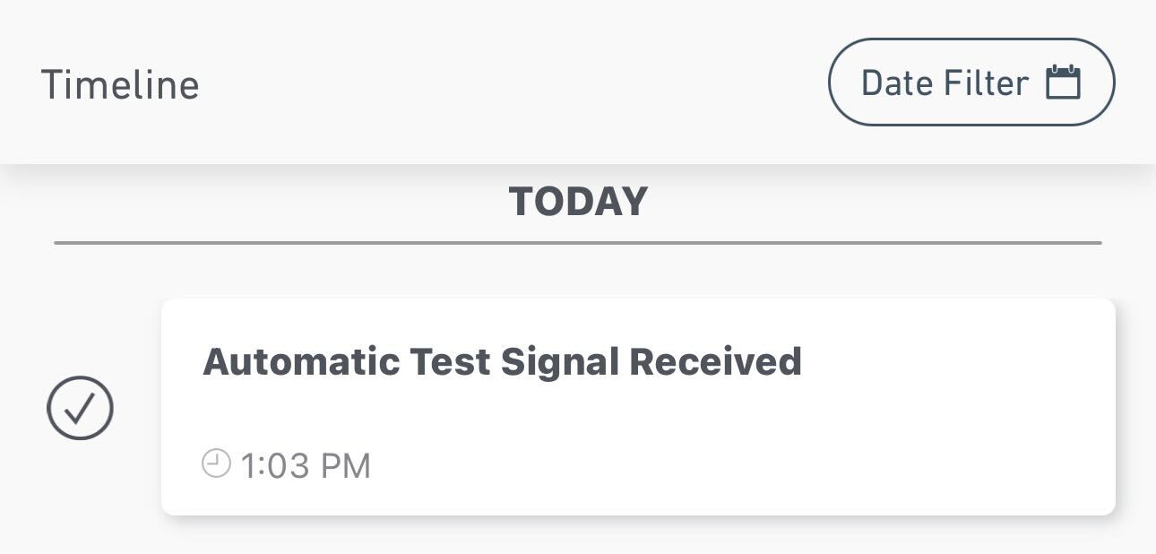 A snapshot of the Timeline within the SimpliSafe® App. The text reads, "Automatic Test Signal Received".