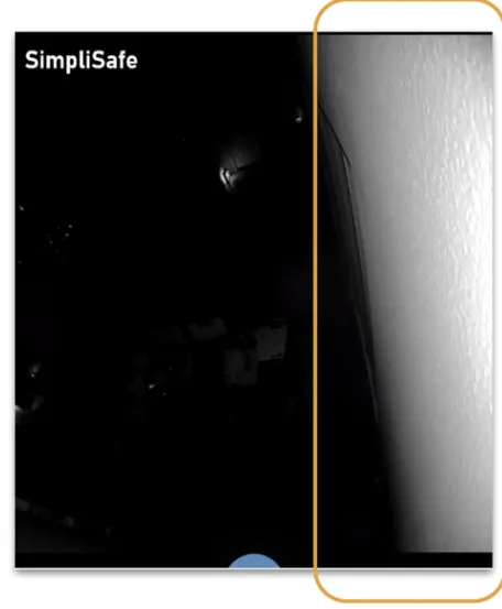 A camera's point of view where the white of the wall is washing out the rest of the imag