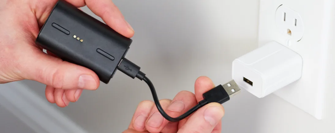 Charge Outdoor Camera battery by plugging it into a compatible power brick.
