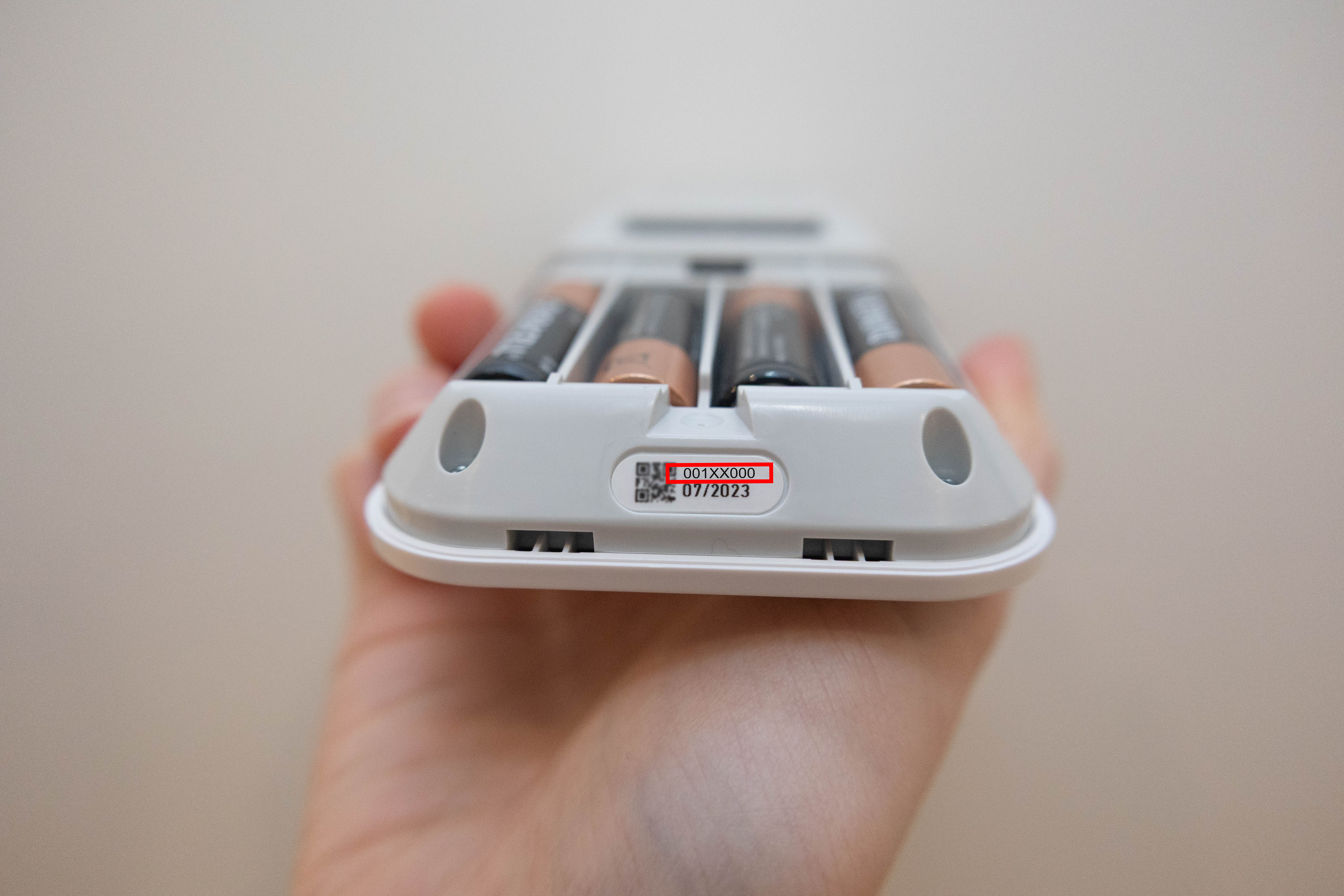 Remove the back of the keypad to expose the keypad serial number